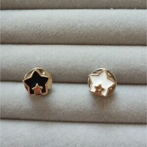 Black and white Star in star brooch/pins